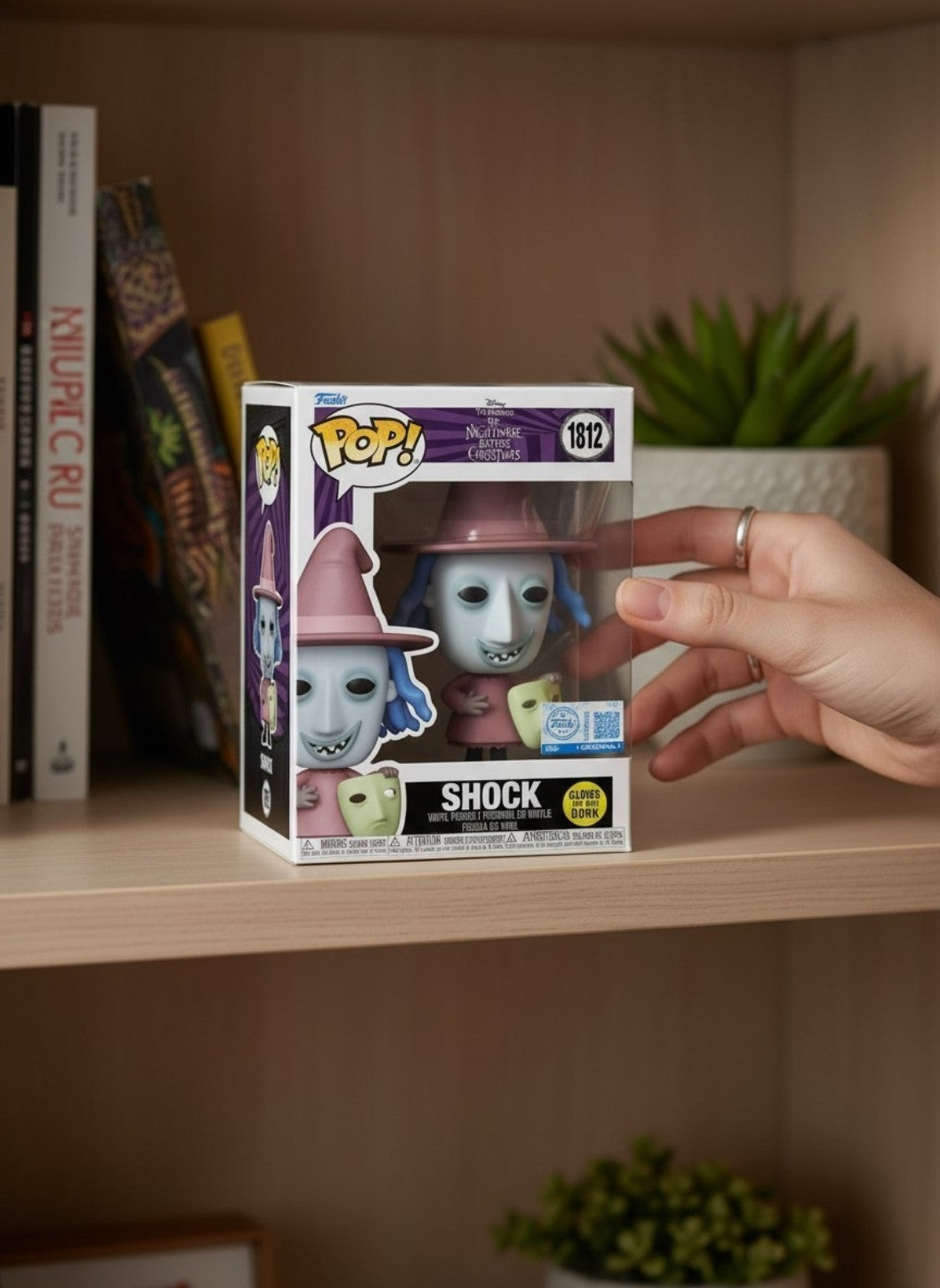 Funko Pop Shock 1812 from The Nightmare Before Christmas displayed on a collector shelf